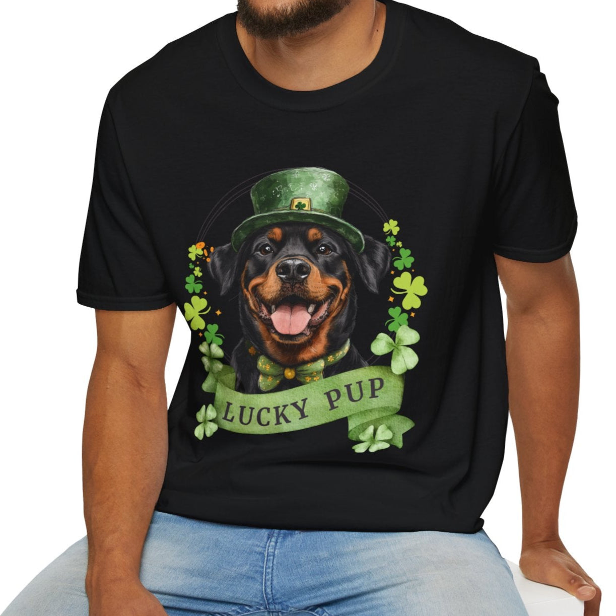 A man in a St. Patrick’s Day black t-shirt gift for dog lovers featuring a Rottweiler dog with a shamrock garland and festive Irish design