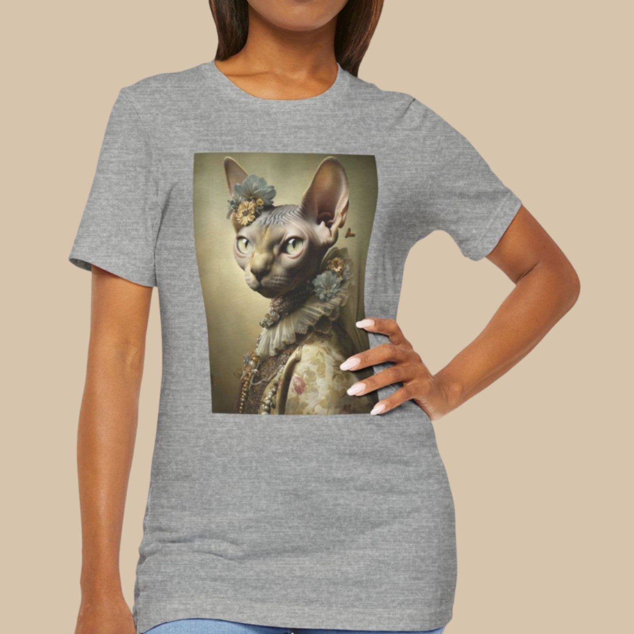 Woman wearing a gray t-shirt with a cat graphic on a white background