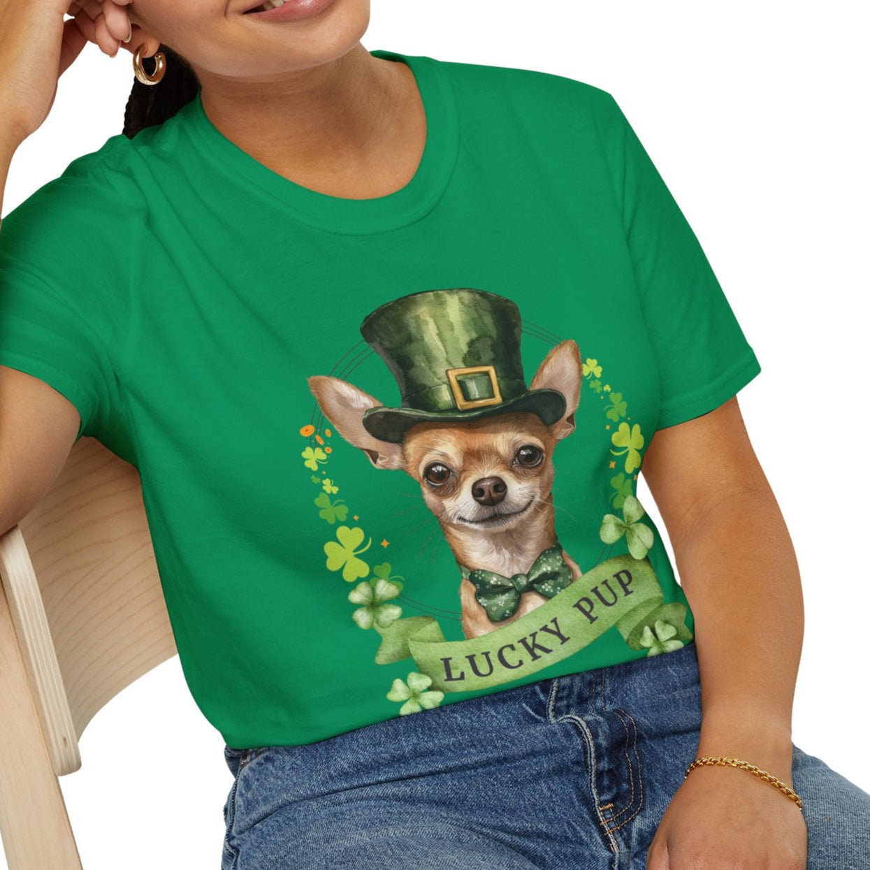 a woman in a green St. Patrick’s Day t-shirt featuring a Chihuahua dog with a shamrock garland and festive Irish design