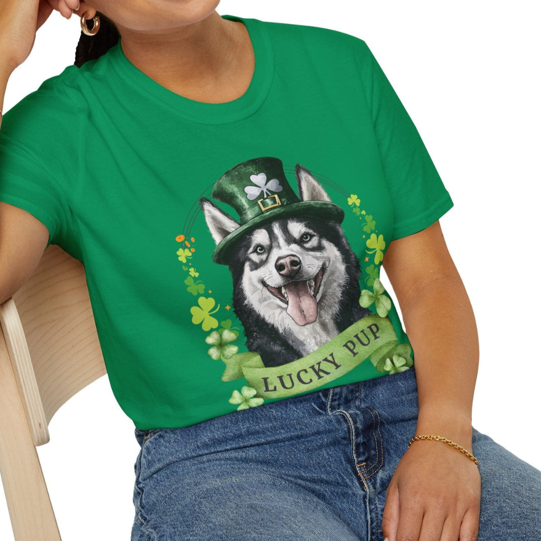 A woman in a kelly green St. Patrick’s Day t-shirt gift for dog lovers featuring Siberian Husky dog with a shamrock garland and festive Irish design