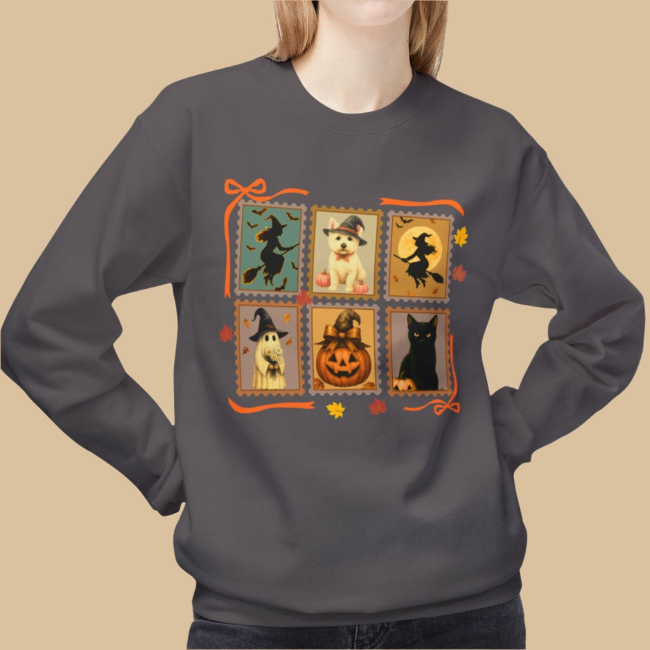 Person wearing a charcoal sweatshirt with Halloween-themed design on a white background