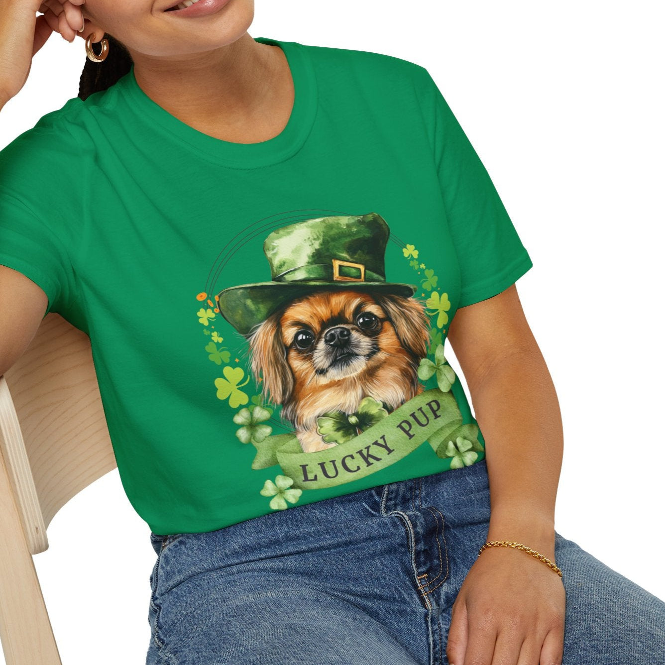 A young woman in a St. Patrick’s Day kelly green t-shirt gift for dog lovers featuring a Pekingese dog with a shamrock garland and festive Irish design