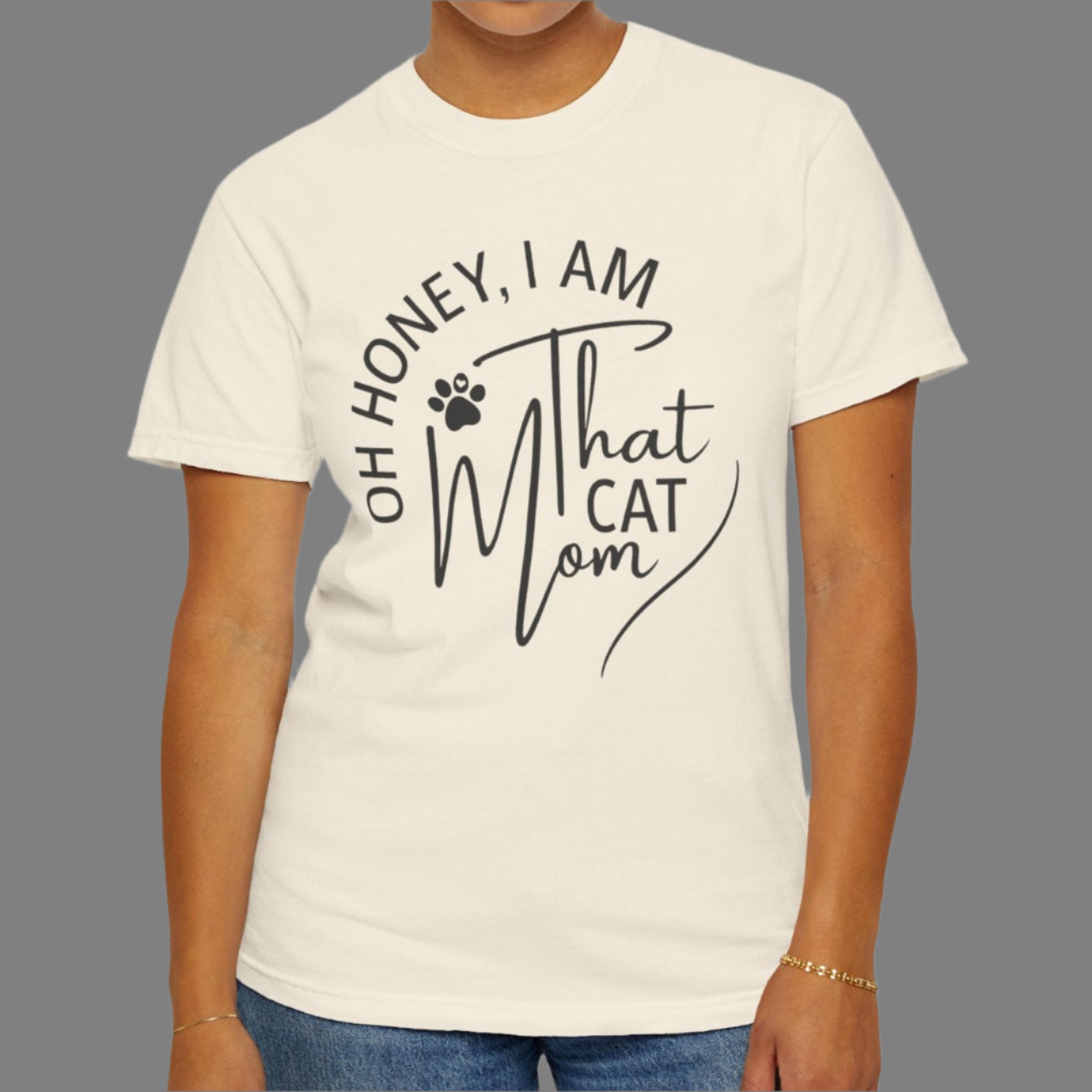 Person wearing a white t-shirt with text design on a plain background