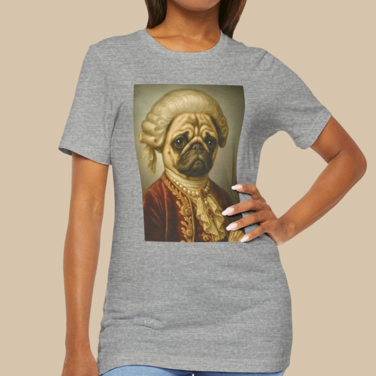 Woman wearing a gray t-shirt with a graphic of a pug in formal attire on a white background