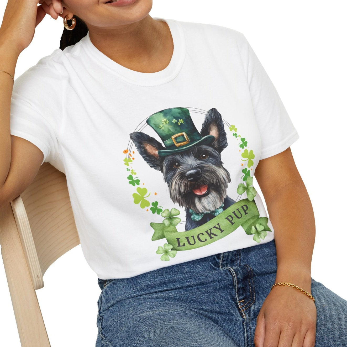 A person wearing St. Patrick’s Day scottish terrier dog white t-shirt with a lucky shamrock print, great for dog lovers