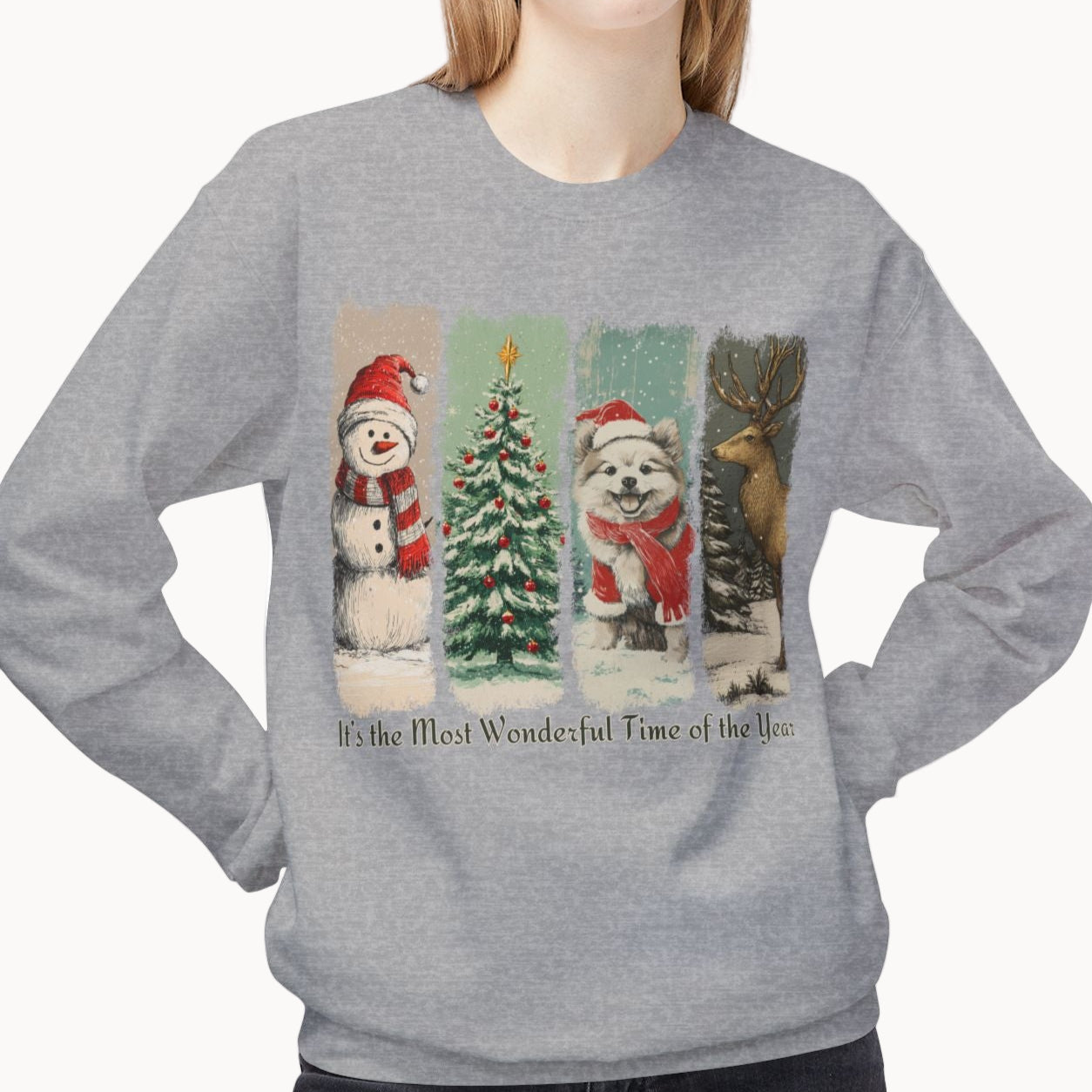 Person wearing a gray sweatshirt with Christmas-themed design