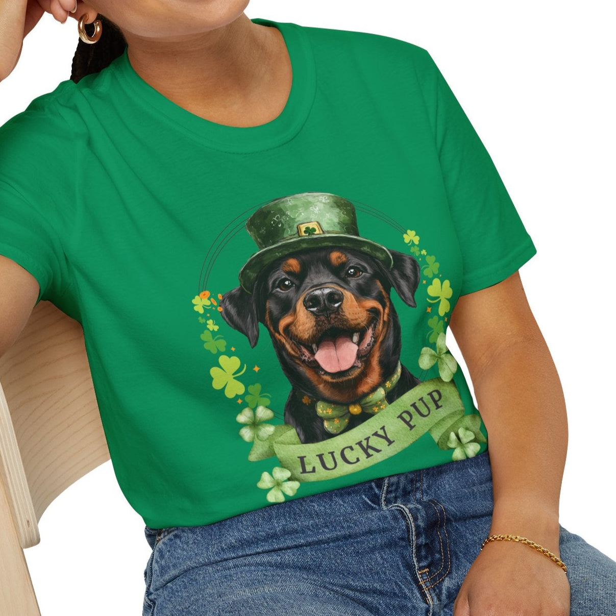 A woman in a St. Patrick’s Day kelly green t-shirt gift for dog lovers featuring a Rottweiler dog with a shamrock garland and festive Irish design
