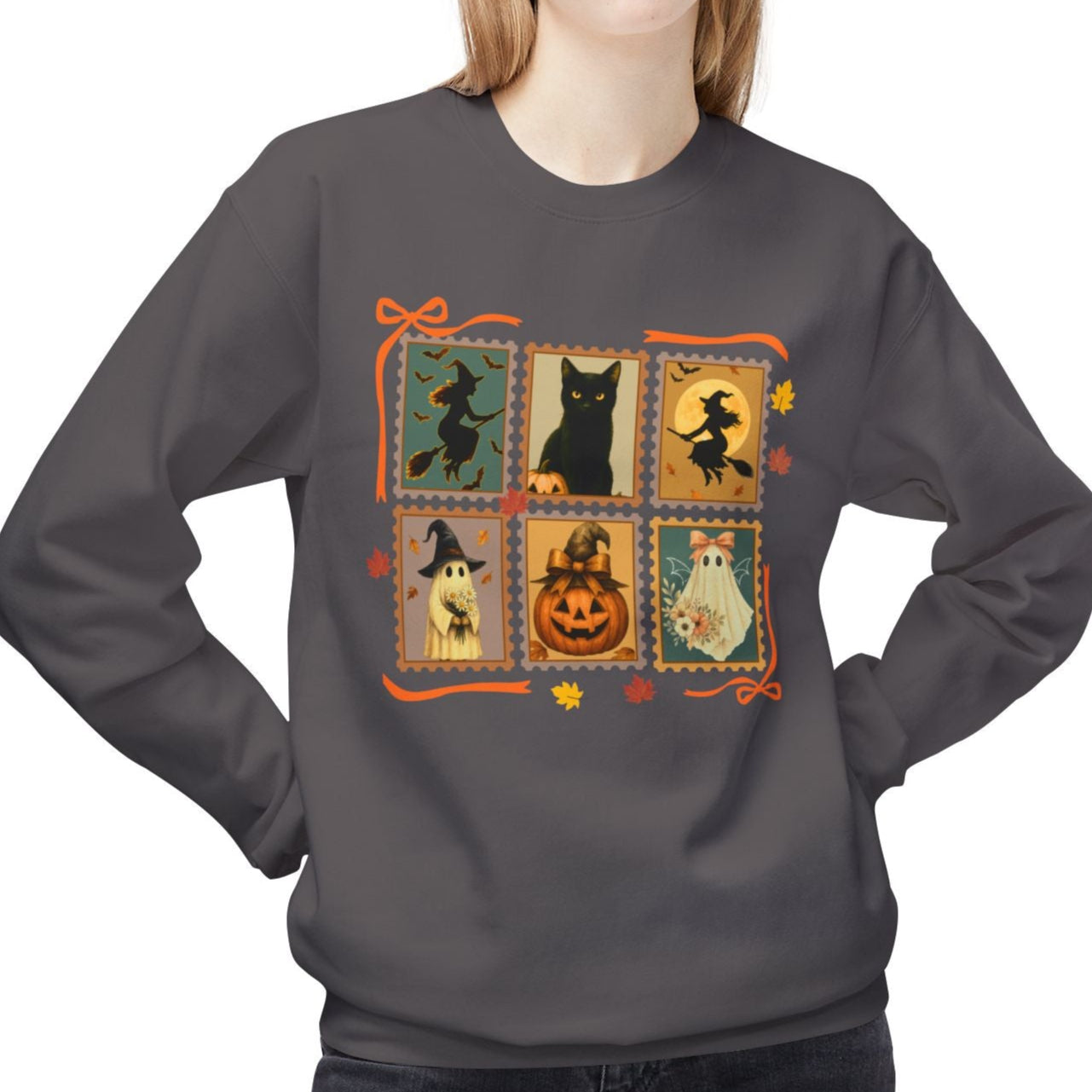 Person wearing a dark gray sweatshirt with Halloween-themed design on a white background