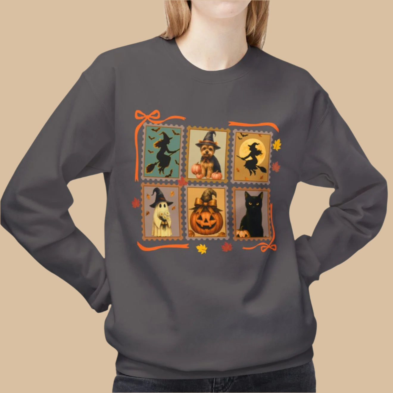 Person wearing a charcoal sweatshirt with Halloween-themed design on a white background