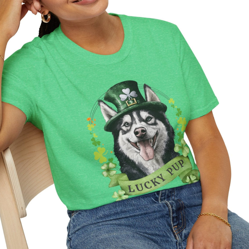 A woman in a heather kelly green St. Patrick’s Day t-shirt gift for dog lovers featuring Siberian Husky dog with a shamrock garland and festive Irish design
