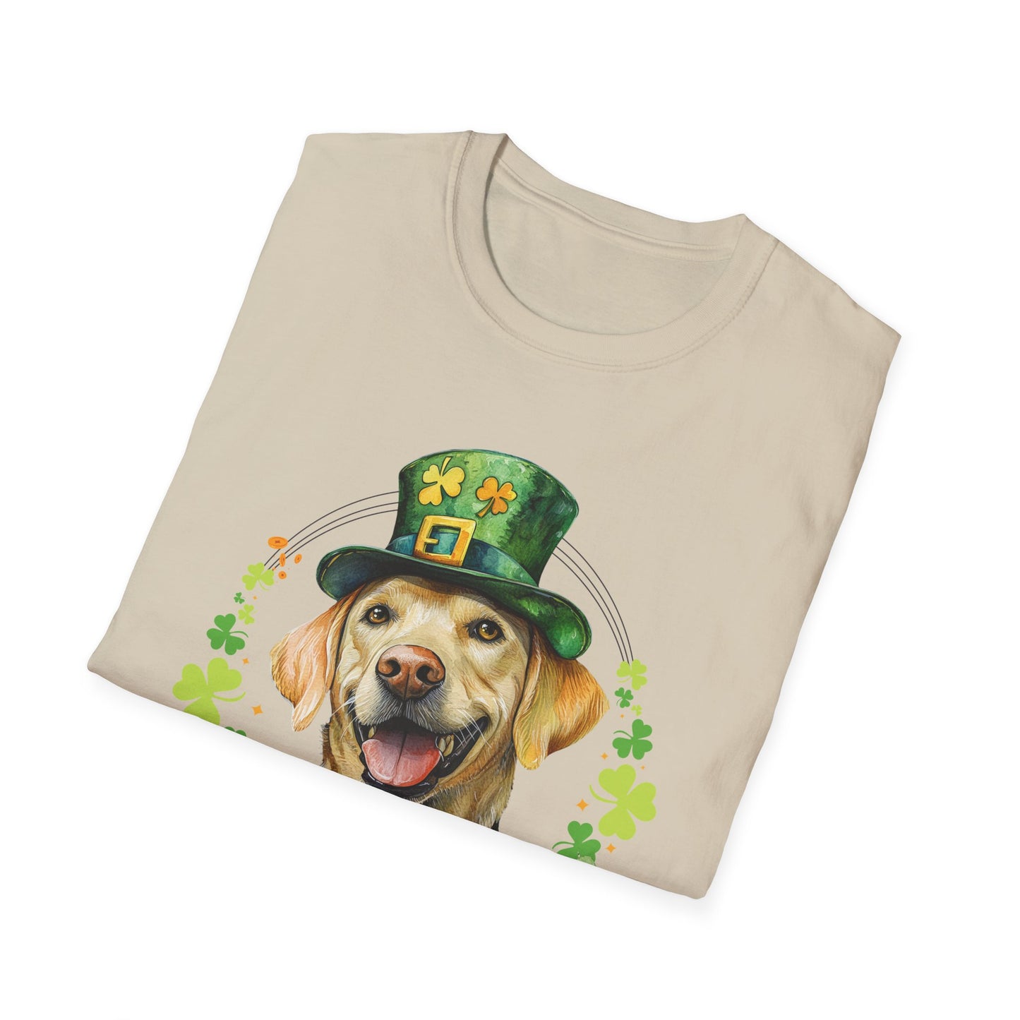 folded sand color St. Patrick’s Day t-shirt featuring a yellow labrador retriever dog with a shamrock garland and festive Irish design