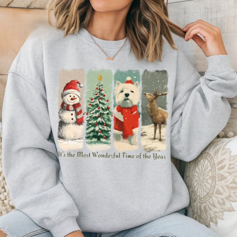 Person wearing a gray sweatshirt with Christmas-themed graphics and text.