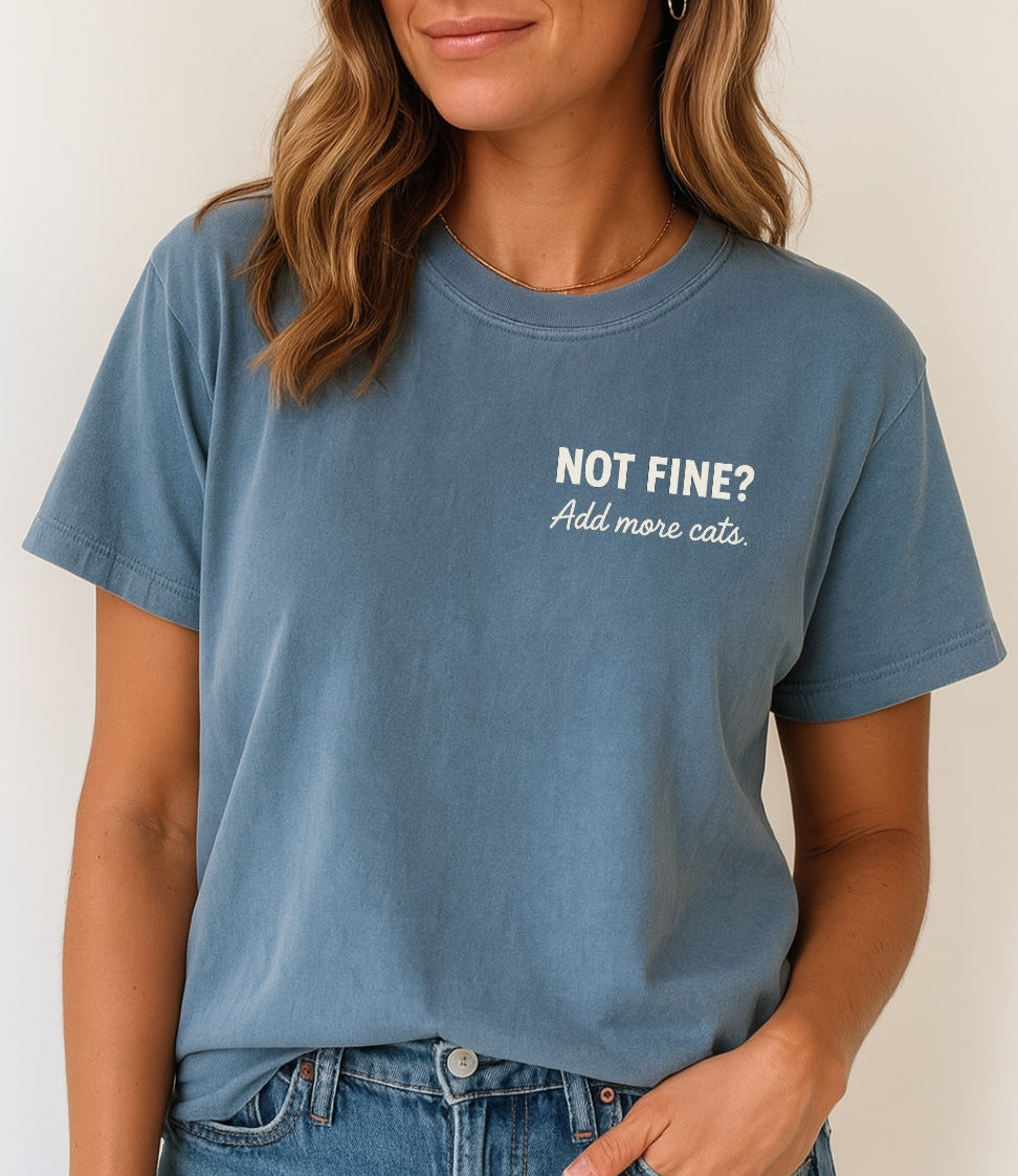 Person wearing a blue t-shirt with text on a plain background