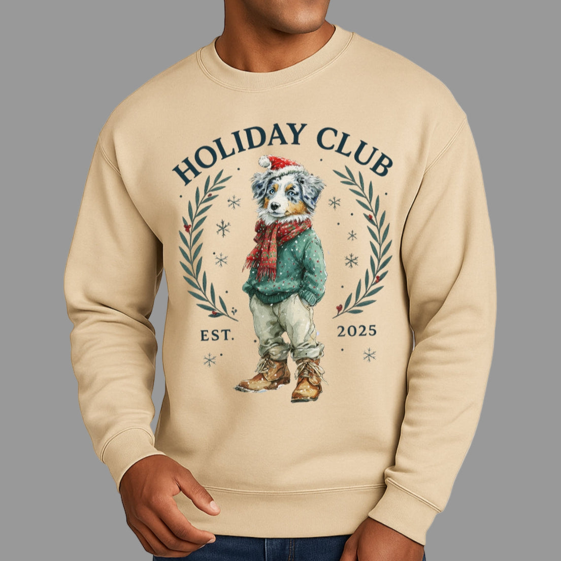Man wearing a beige sweatshirt with a dog graphic and 'Holiday Club' text on a white background
