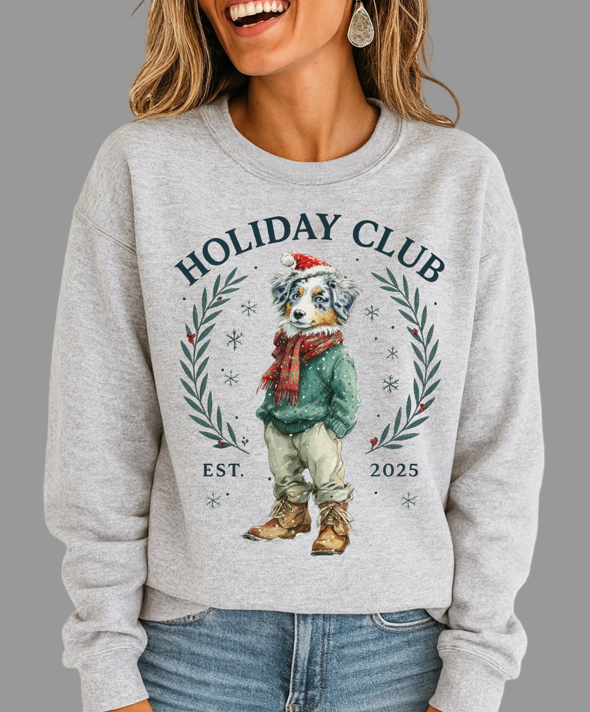 Person wearing a gray sweatshirt with 'Holiday Club' design featuring a bear illustration.