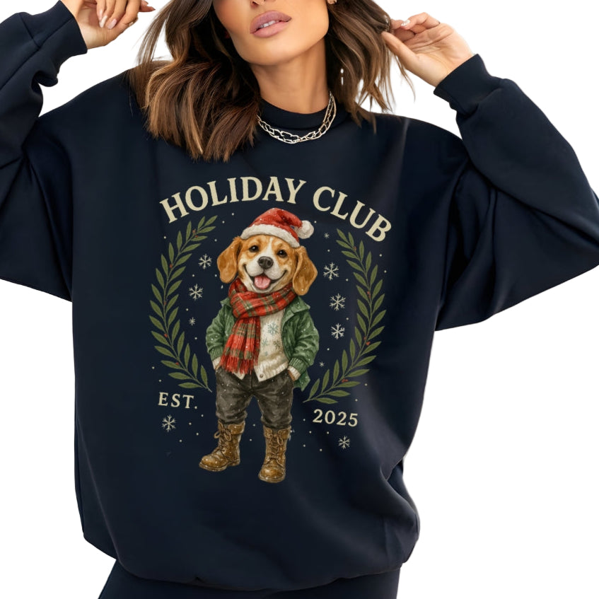 Person wearing a navy blue sweatshirt with a holiday-themed design featuring a dog and text.