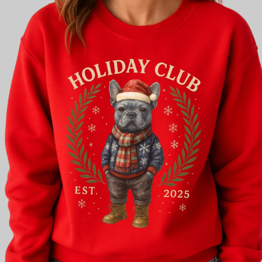 Person wearing a red sweatshirt with a dog graphic and 'Holiday Club' text on a plain background