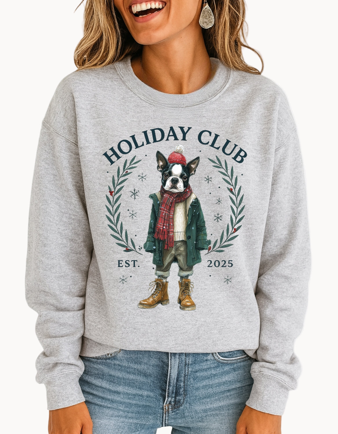 Person wearing a gray sweatshirt with a holiday-themed design featuring a dog and 'Holiday Club' text.