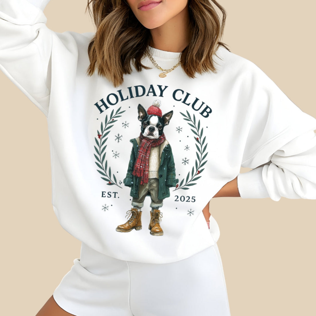 Woman wearing a white sweatshirt with a holiday-themed design featuring a dog and text.