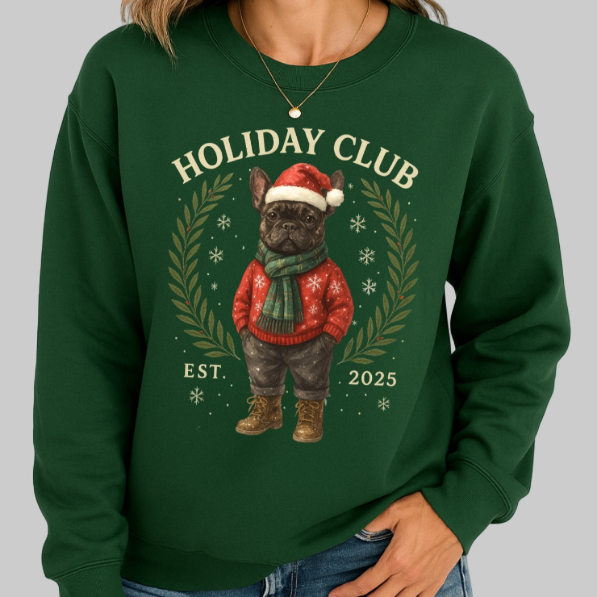 Green sweatshirt with a festive dog graphic and 'Holiday Club' text, worn by a person.