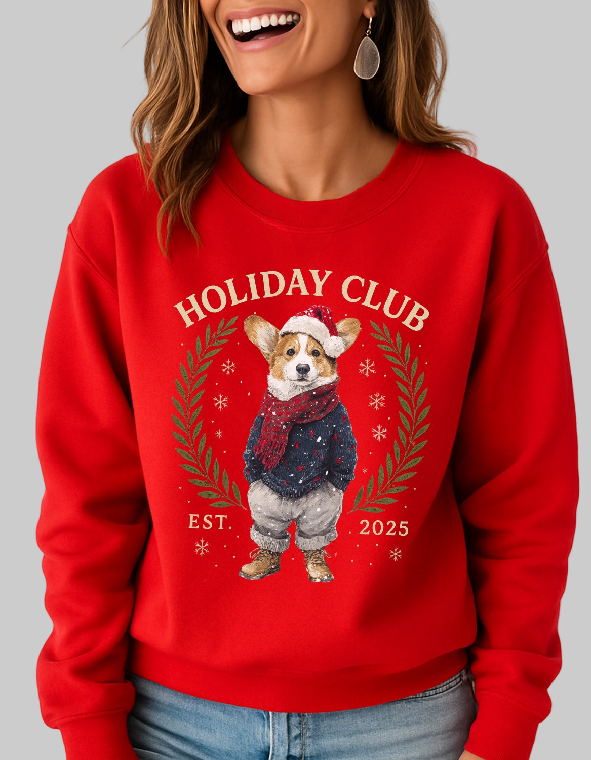 Person wearing a red sweatshirt with a dog graphic and 'Holiday Club' text on a plain background