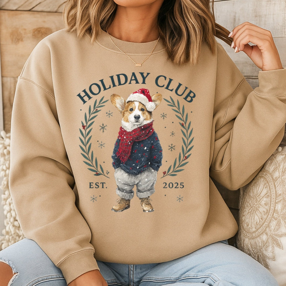 Person wearing a beige sweatshirt with a holiday-themed design featuring a dog and text.