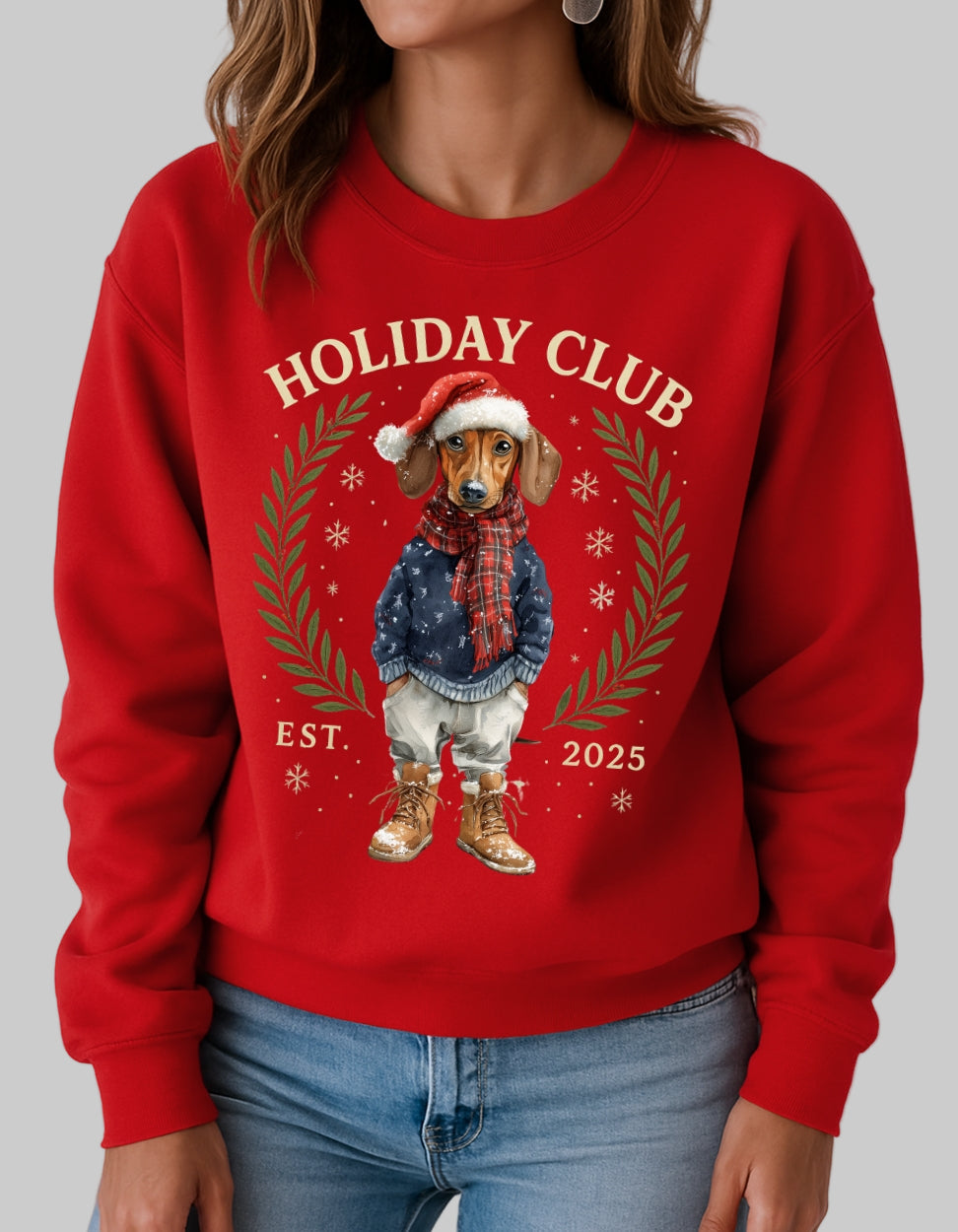 Red sweatshirt with 'Holiday Club' design featuring a dachshund, on a plain background.