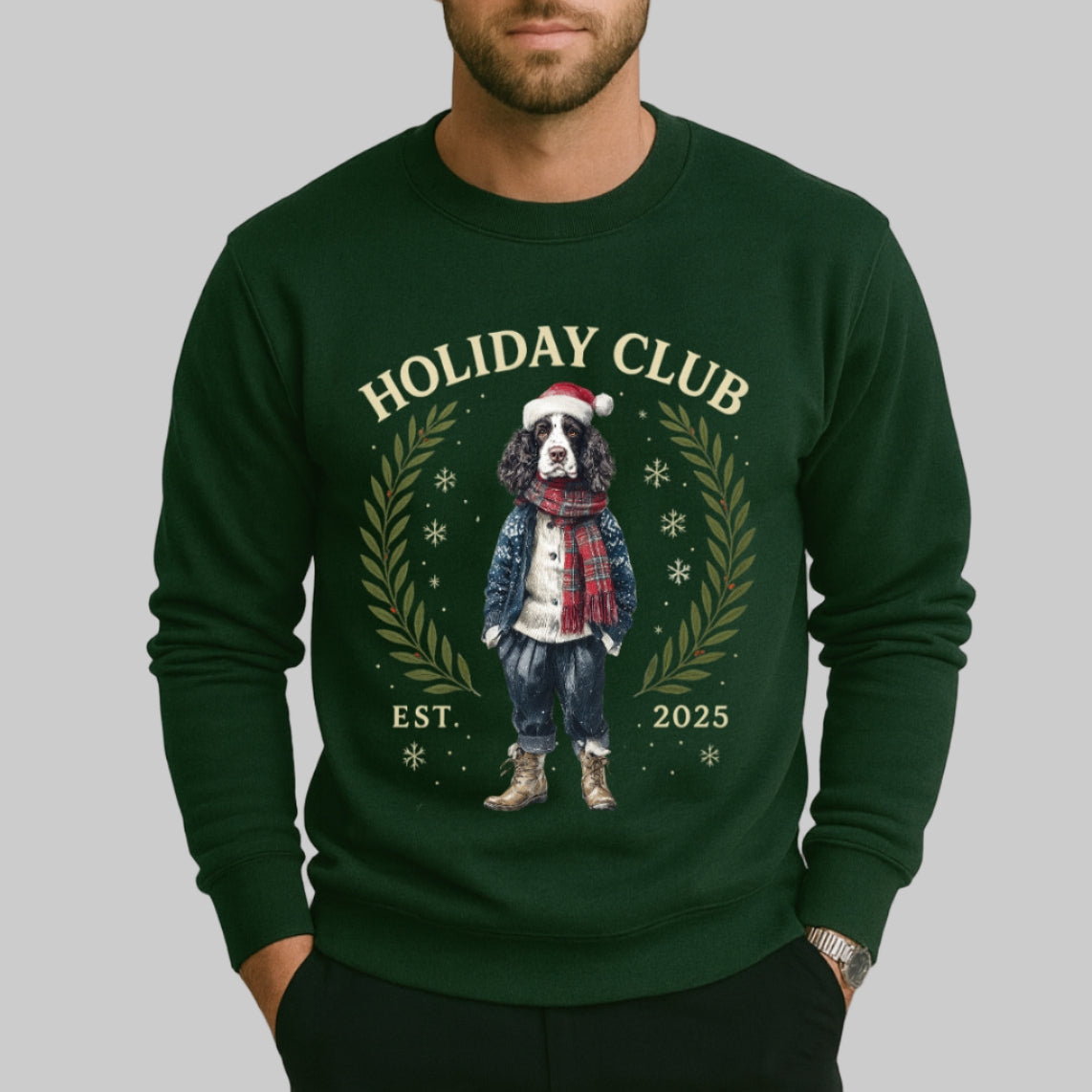 Man wearing a green 'Holiday Club' sweater with a dog graphic on a plain background