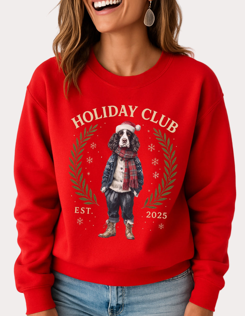 Person wearing a red sweatshirt with 'Holiday Club' and a dog illustration on a white background