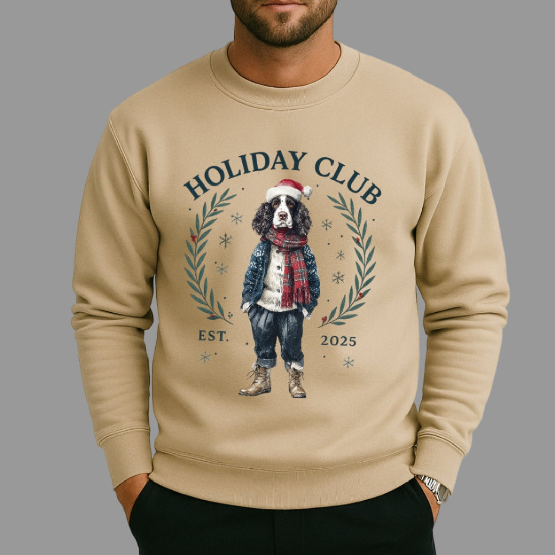Man wearing a beige sweatshirt with a dog graphic and 'Holiday Club' text on a plain background