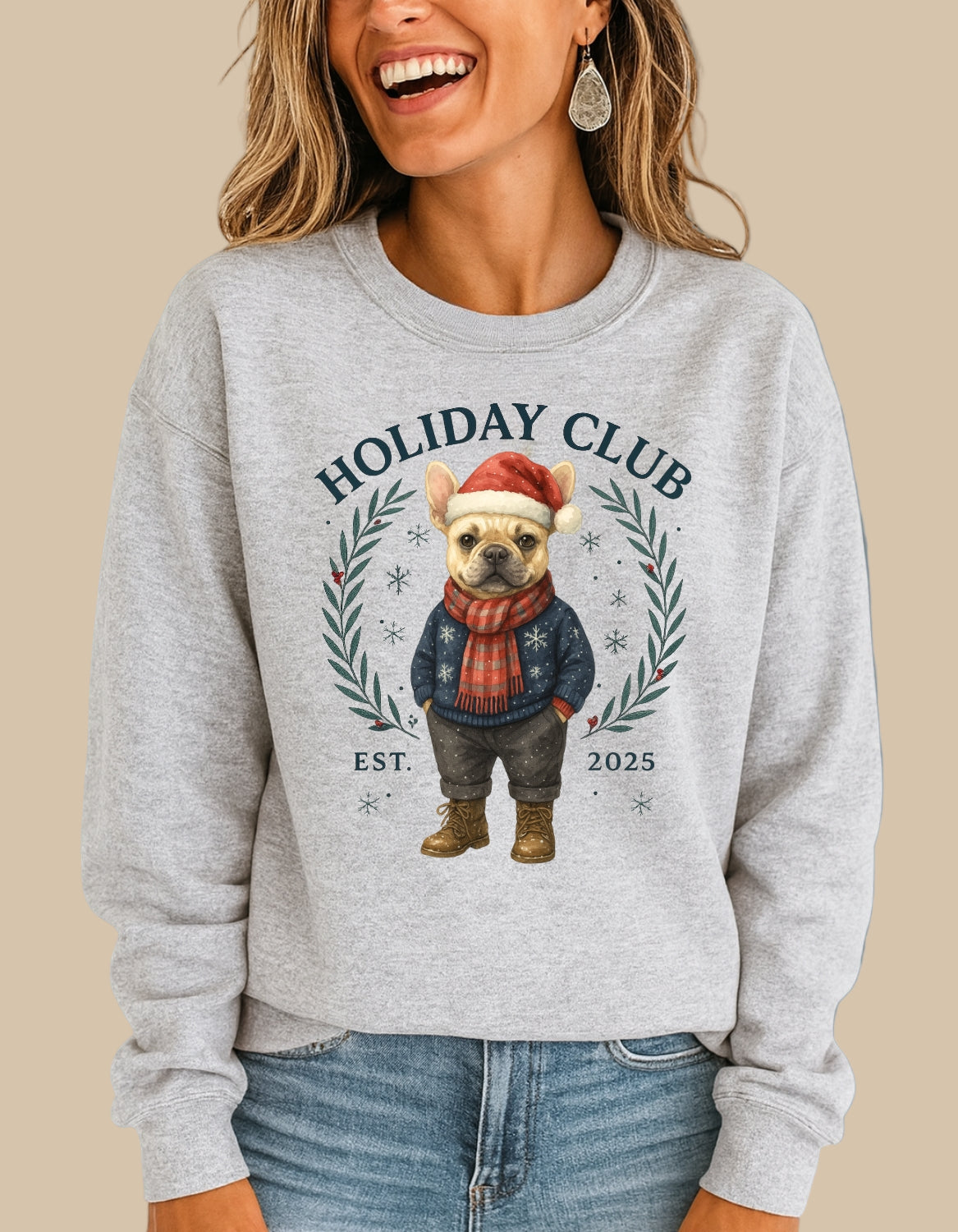 Person wearing a gray sweatshirt with a dog illustration and 'Holiday Club' text.