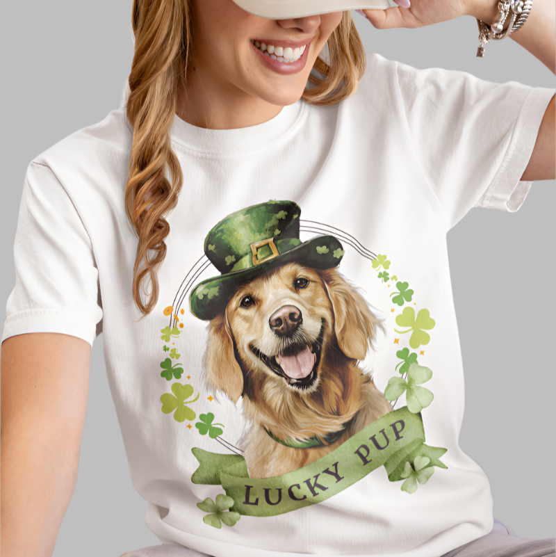woman wearing white St. Patrick’s Day t-shirt featuring a golden retriever dog with a shamrock garland and festive Irish designan