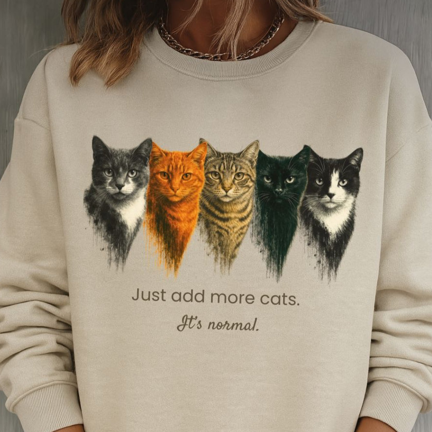 sand cat lover sweatshirt with cat illustrations and text on a gray background