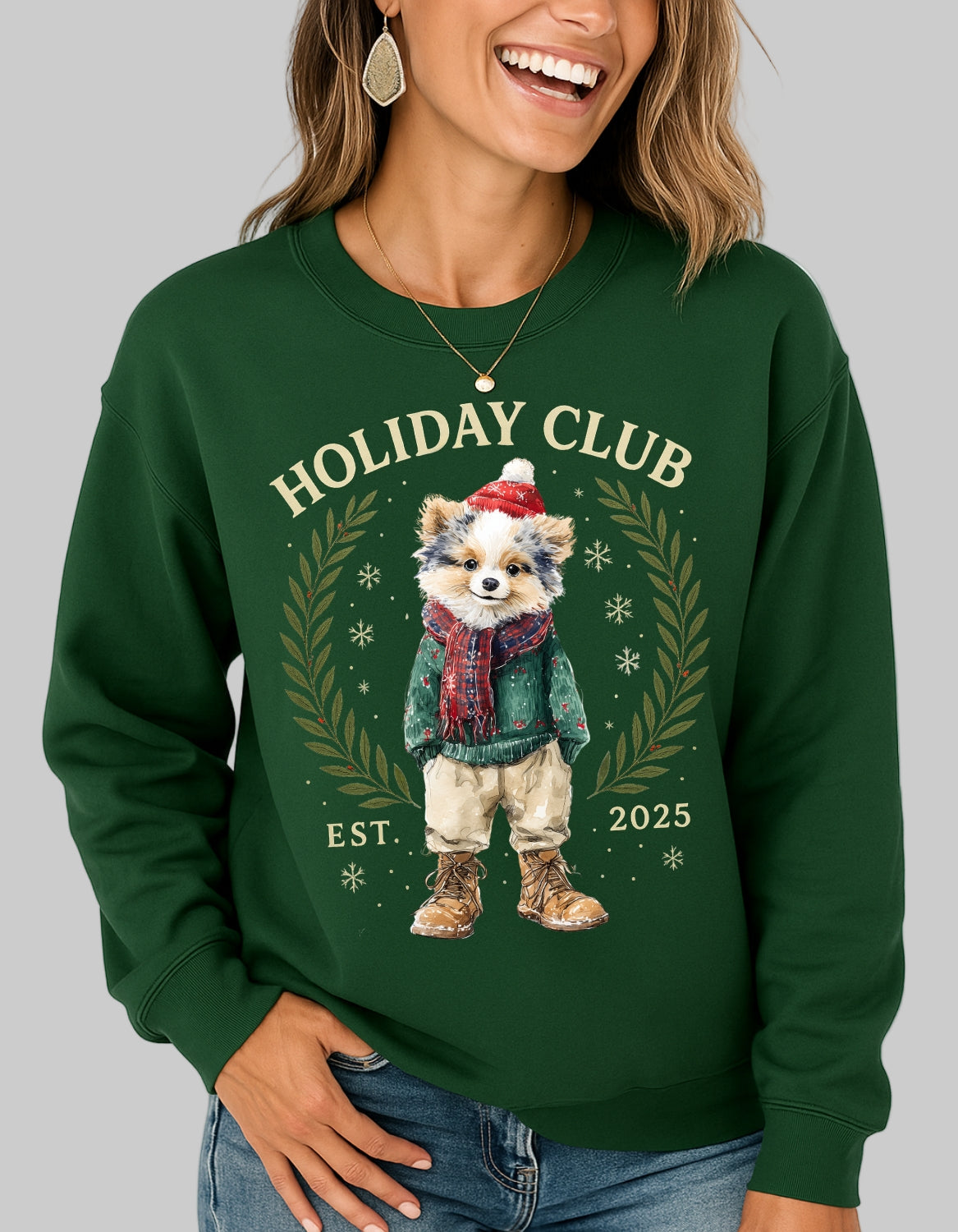 Person wearing a green sweatshirt with a holiday-themed design featuring a bear and text.