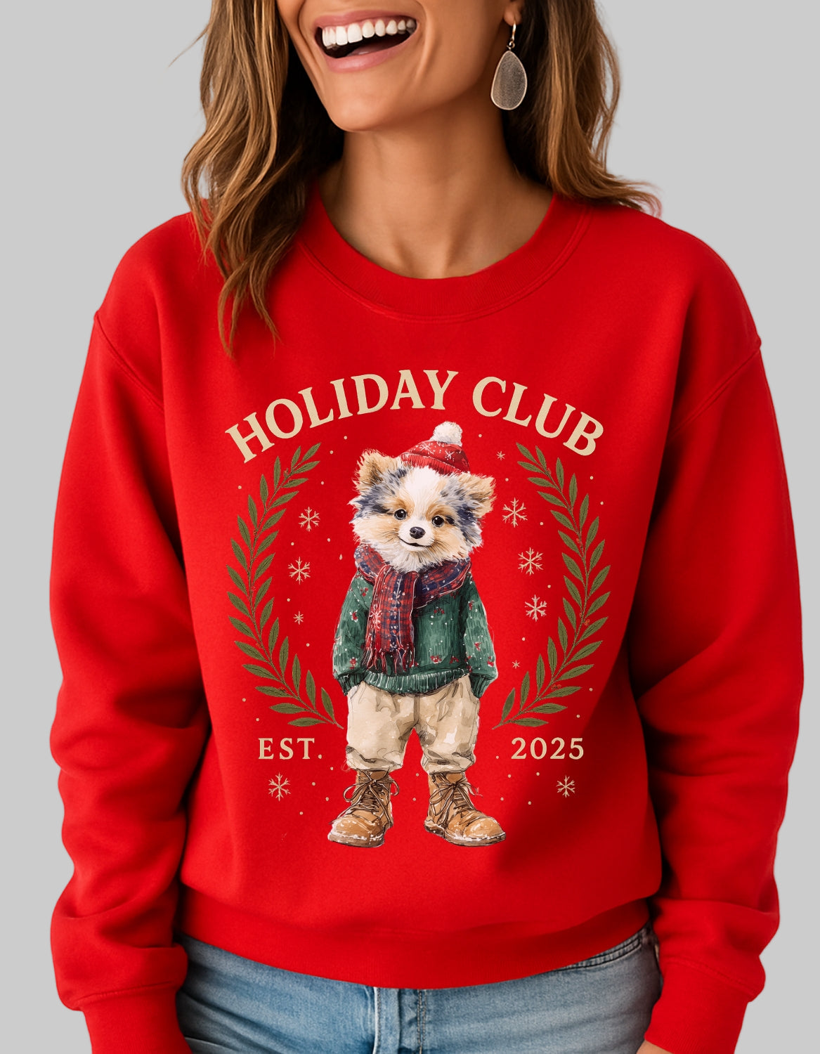 Person wearing a red sweatshirt with a bear graphic and 'Holiday Club' text on a plain background
