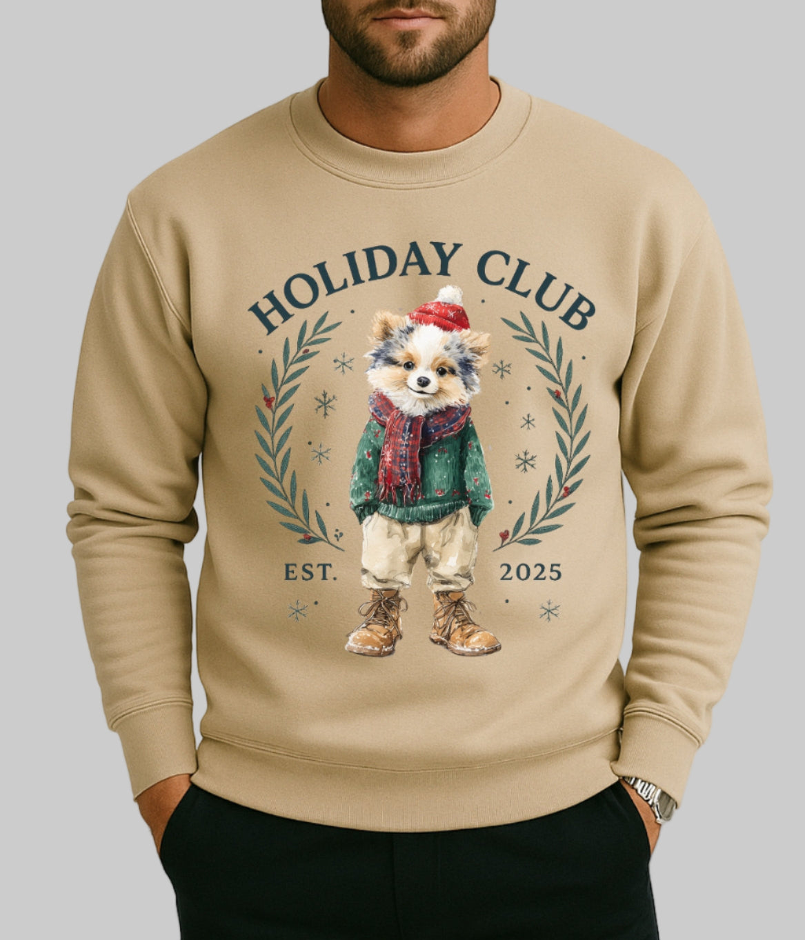 Sand sweatshirt with a festive design of a dog in winter clothing and 'Holiday Club' text.