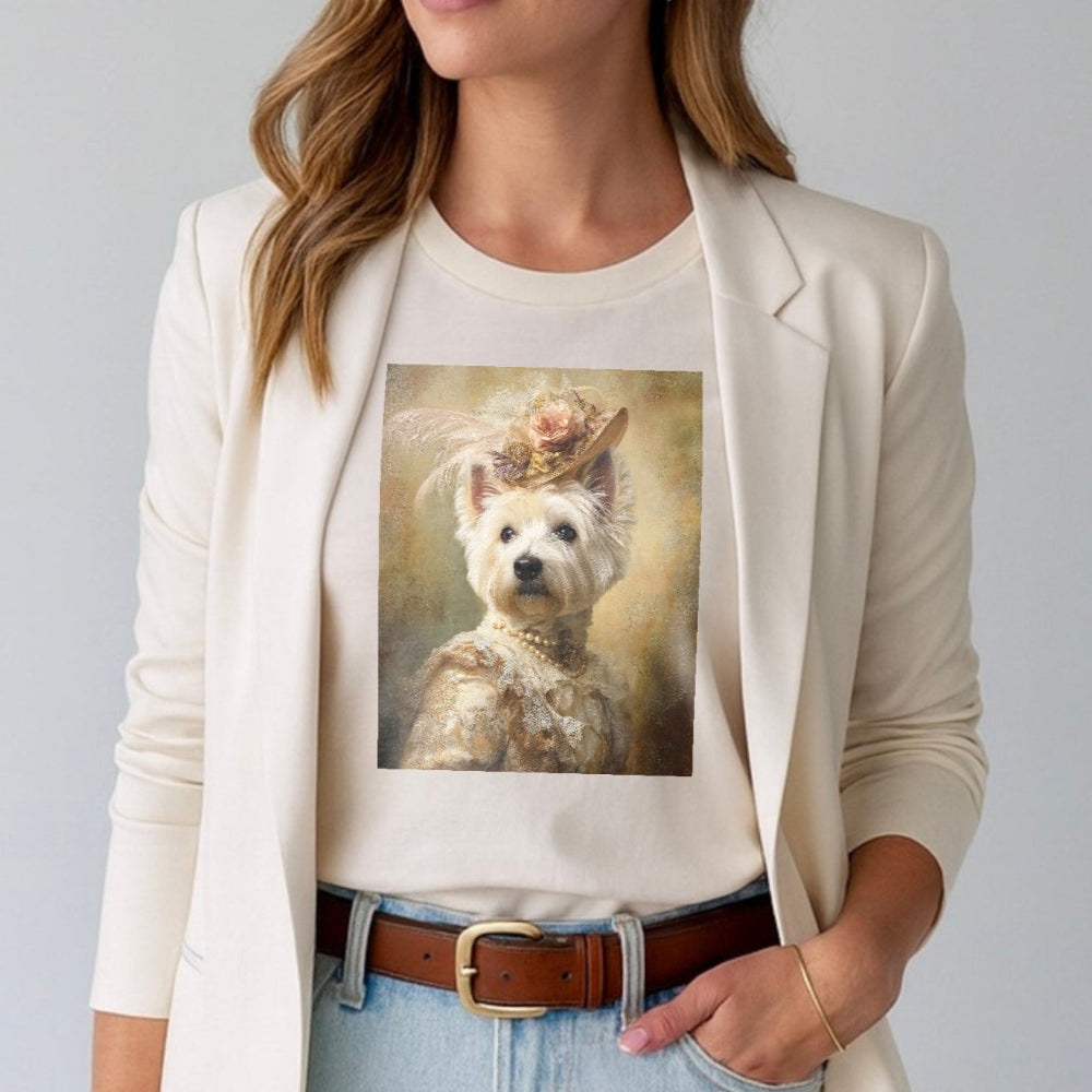 Woman wearing a white t-shirt with a dog graphic and a beige blazer.