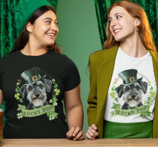 Two women wearing a St. Patrick’s Day dog t-shirt with a lucky shamrock print, schnauzer dog lucky pup, great for dog lovers