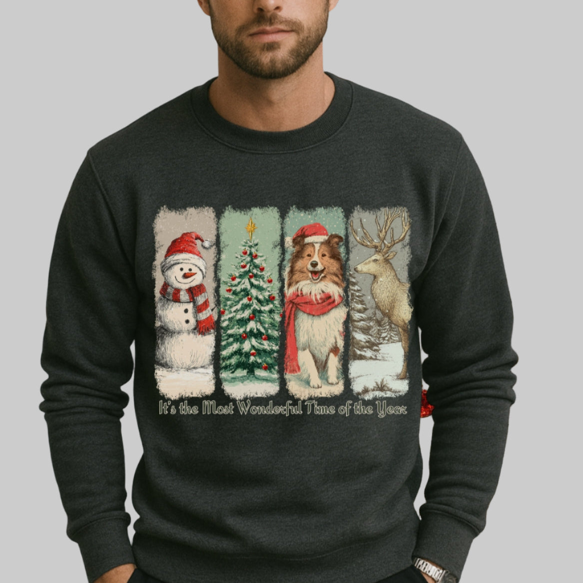 Person wearing a black sweater with Christmas-themed designs in front of a decorated Christmas tree.