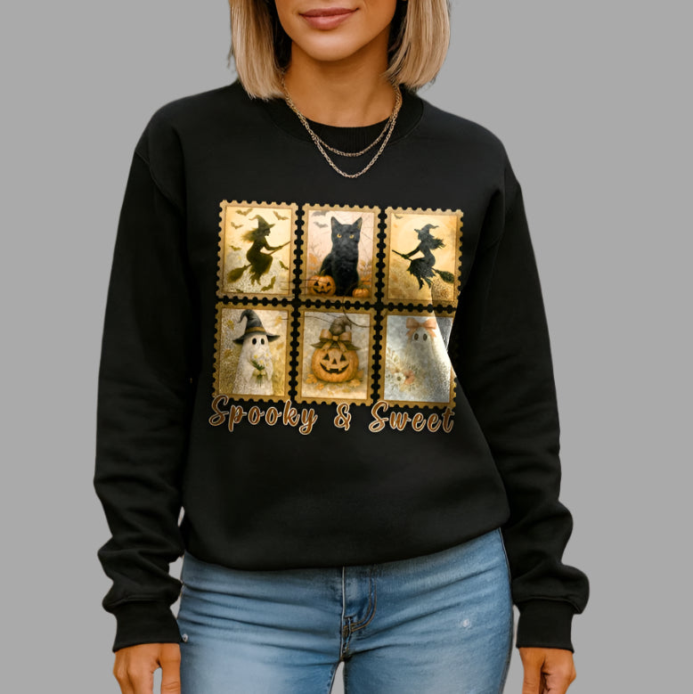 Woman wearing a black sweatshirt with Halloween-themed design in an outdoor setting with pumpkins.