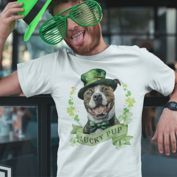 A Man wearing white St. Patrick’s Day t-shirt featuring a stafforshire bull terrier with a shamrock garland and festive Irish design
