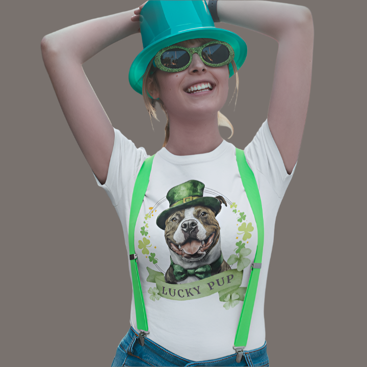 A woman in a white St. Patrick’s Day t-shirt featuring a stafforshire bull terrier with a shamrock garland and festive Irish design