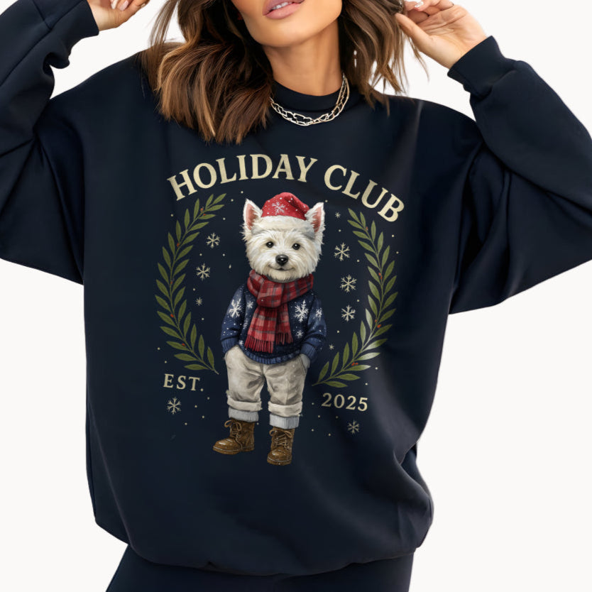 Person wearing a navy blue sweatshirt with a holiday-themed design featuring a dog and text.