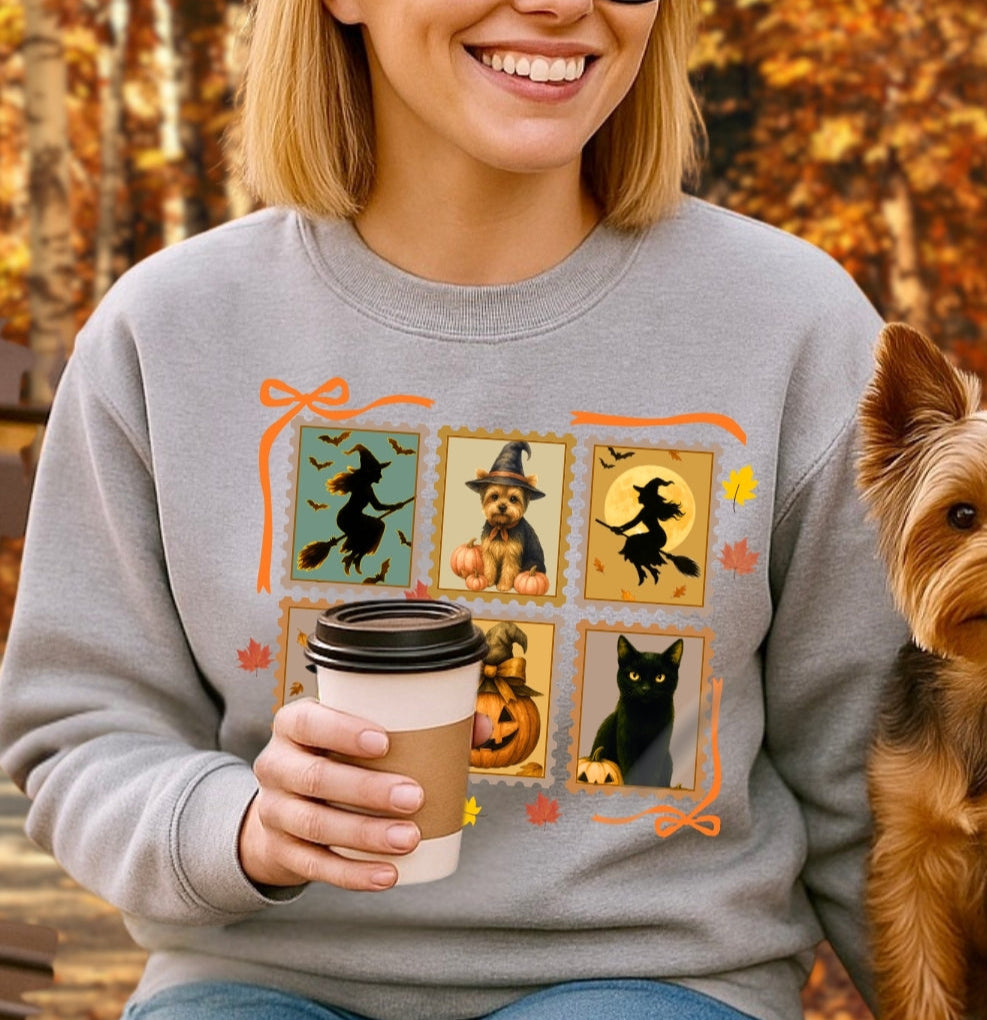 Woman wearing a sweatshirt with Halloween-themed designs, holding a coffee cup, and sitting next to a dog.