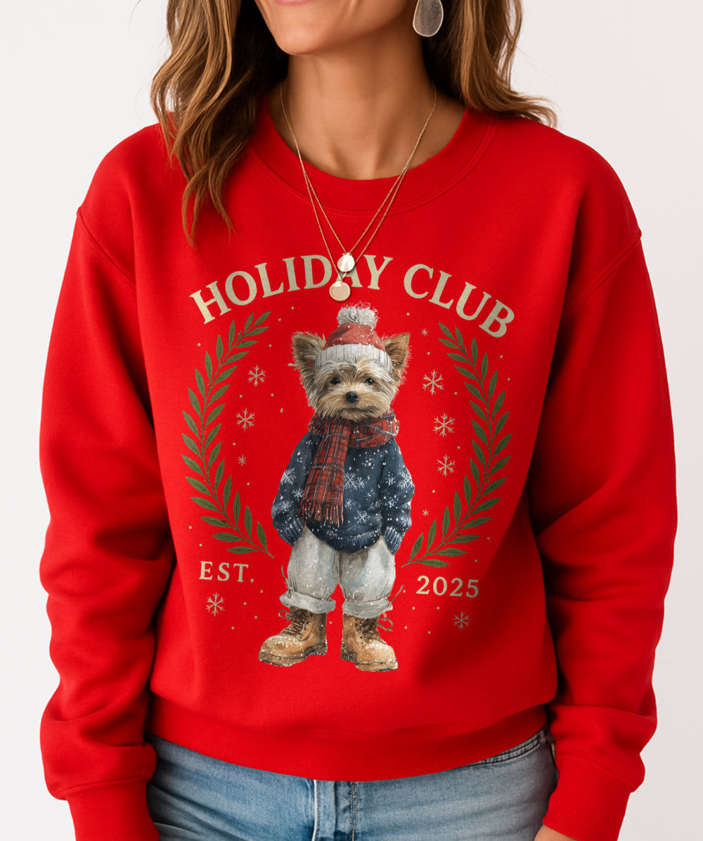 Person wearing a red sweatshirt with a dog graphic and 'Holiday Club' text.