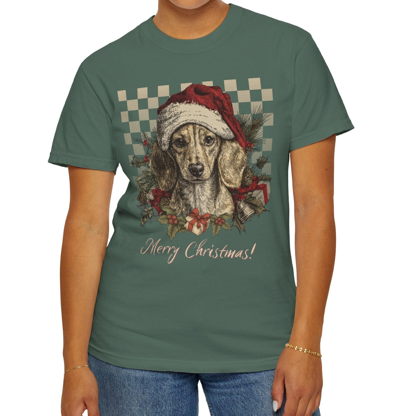 Person wearing a green t-shirt with a Christmas-themed dog graphic and 'Merry Christmas!' text.