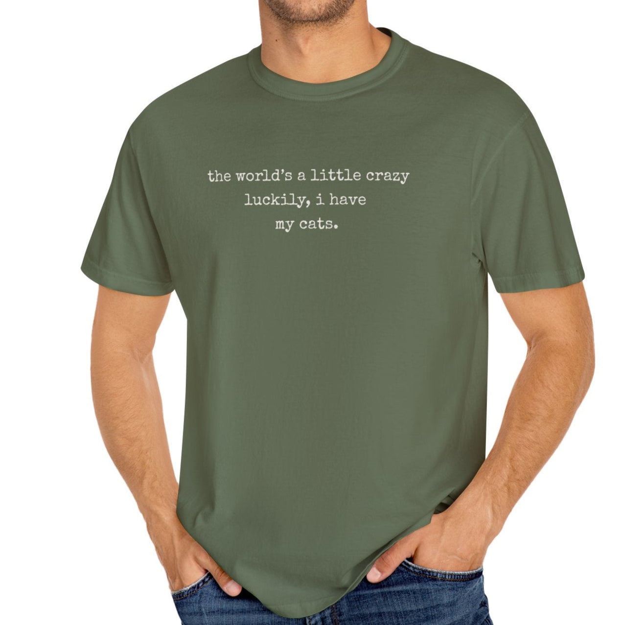 Man wearing a green t-shirt with text on a white background