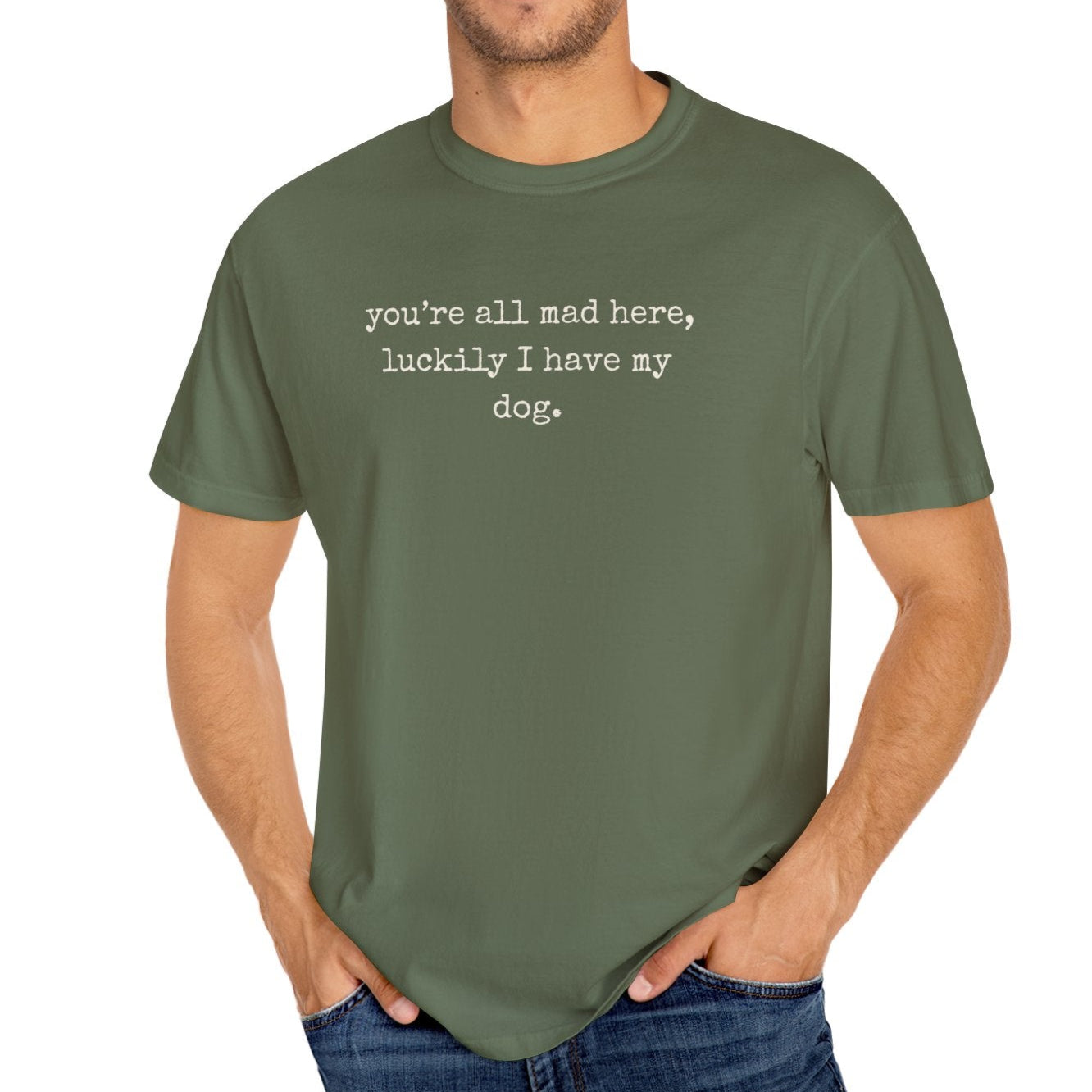 Man wearing a green t-shirt with text on a white background