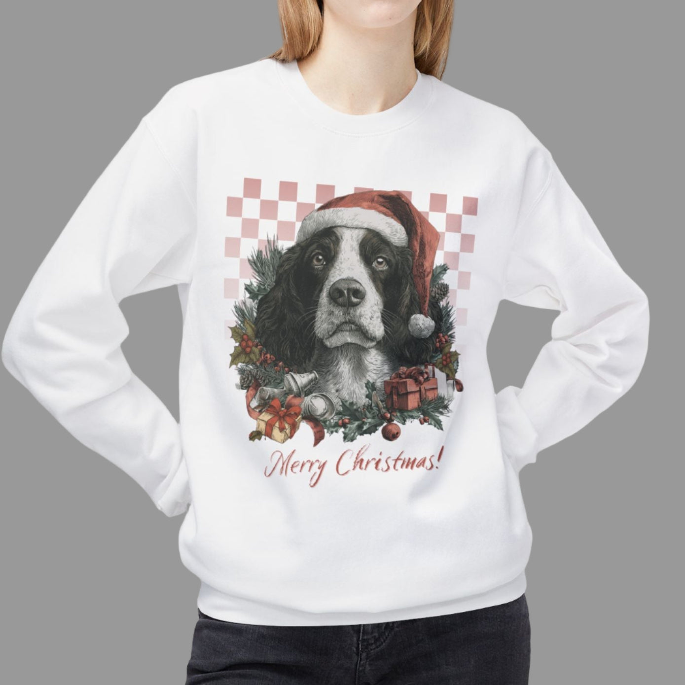 Person wearing a white sweatshirt with a Christmas-themed dog design on a white background
