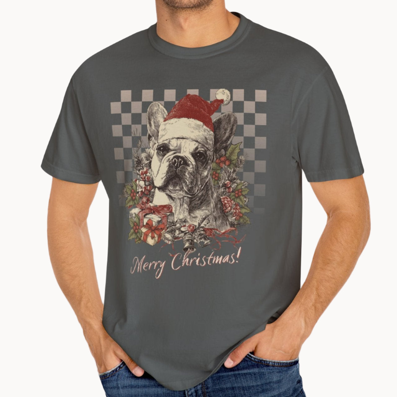 Man wearing a gray t-shirt with a Christmas-themed design of a dog wearing a Santa hat.